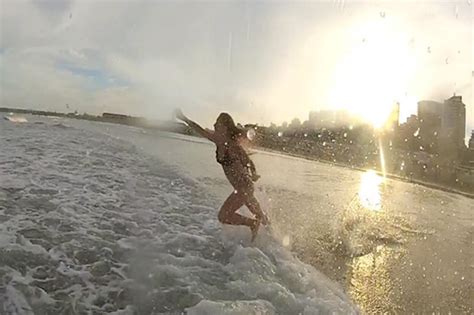 bikini babe crashes face first into waves in beach fail