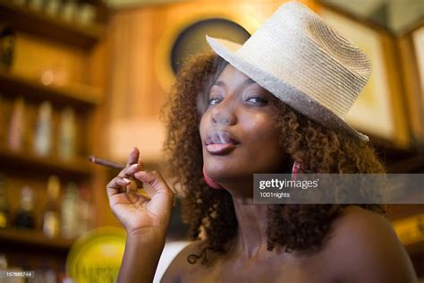 cute black woman smoking cigar stockfoto getty images
