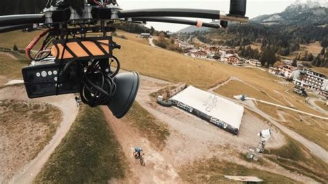 photographer lit  biker  stunts   elinchrom strobe mounted   drone