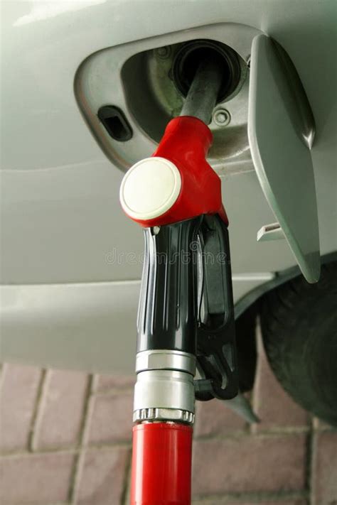 red gas station nozzle stock image image  conserve