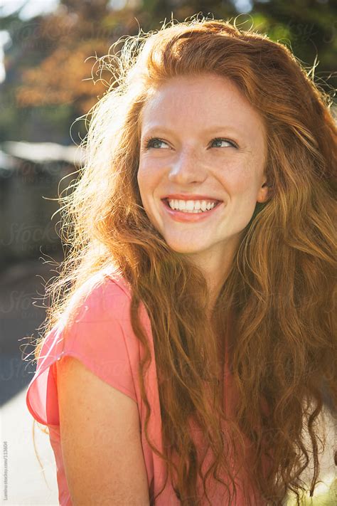 ginger woman with a sunny smile porlumina