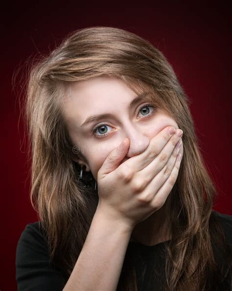 young woman covering  face   hand stock photo image  close