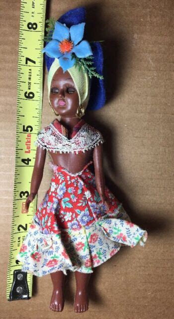 Vintage Caribbean Jamaican Doll Made Of Hard Plastic With Closing Eyes