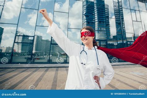 female doctor   superhero cape  ready   stock photo