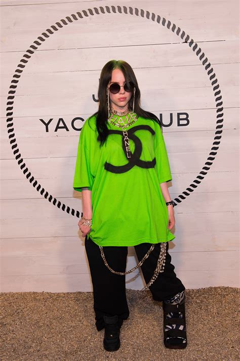 singer billie eilish wears oversized neon   nyc chanel dinner footwear news