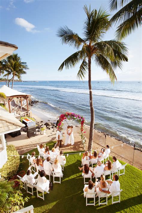 intimate hawaii wedding ceremony layout white chairs palm trees