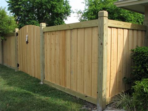 beautiful  capped wood fence gate design  mossy oak