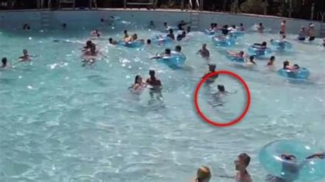 lifeguard saves drowning girl in crowded swimming pool daily telegraph
