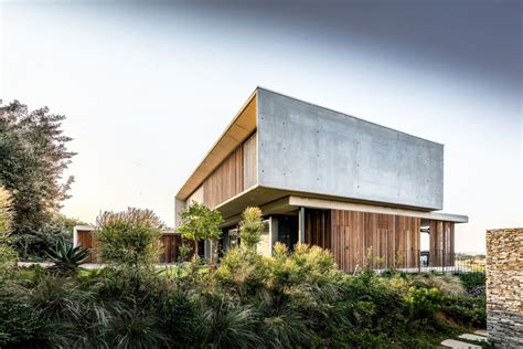 concrete  wood house brings  outdoors    swimming pool
