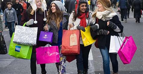 christmas shoppers hit the high street and boost retailers after prices slashed mirror online