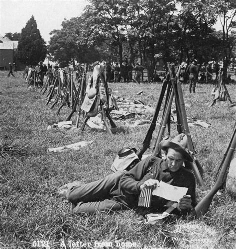 spanish american war  na soldier reading  letter   camp