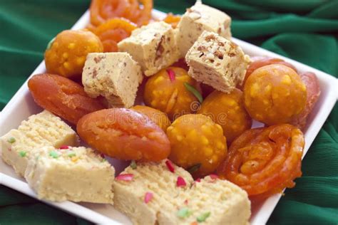 colorful indian diwali sweets   plain white dish stock photo image