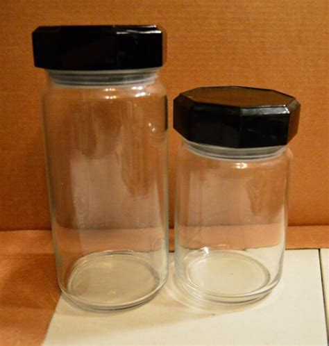 Set Of 2 Clear Glass Round Canisters With Hexagonal Black Plastic Lid