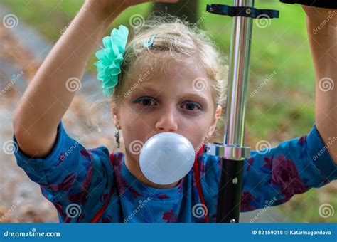 kid blowing chewing gum bubbles stock photo image  childhood enjoy