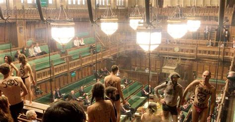 protesters bare almost all to u k parliament which can t look away