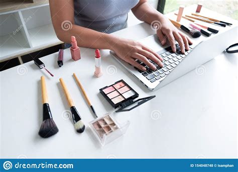 beauty blogger present beauty cosmetics sitting in front