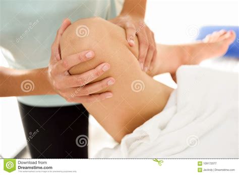 Medical Massage At The Leg In A Physiotherapy Center Stock Image