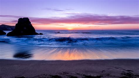 sea ocean waves sand beach rock horizon night sunset lilac
