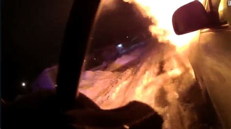 dramatic video shows police rescue trapped woman from burning car cnn