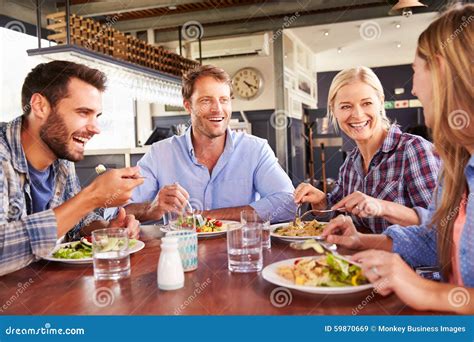 group  friends eating   restaurant stock image image