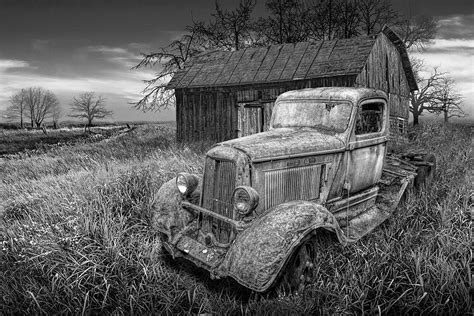 black and white rusted vintage truck with weathered barn photograph by