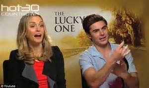 zac efron demonstrates how to unfasten a bra with one hand as he promotes new movie the lucky
