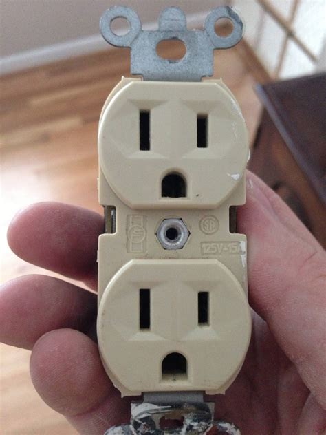 electrical       duplex outlet  takes  wires  ground home