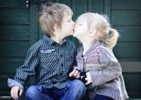 brother and sister kissing photo getty images