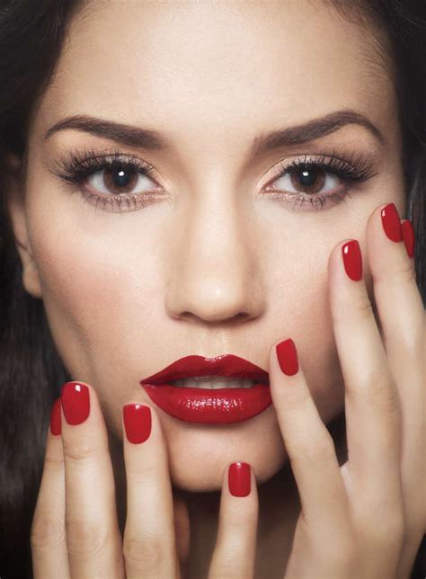 red lipstick and nail polish against porcelain skin beautiful red