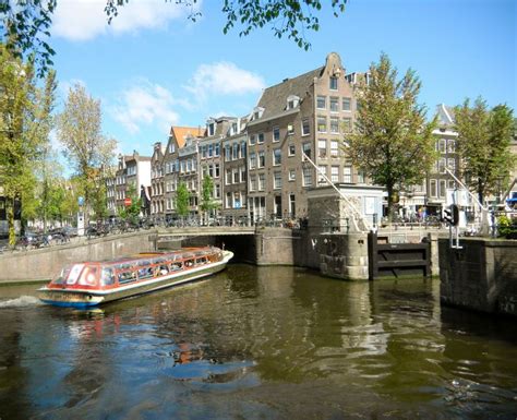 canal boat going through the locks amsterdam travel europe holland