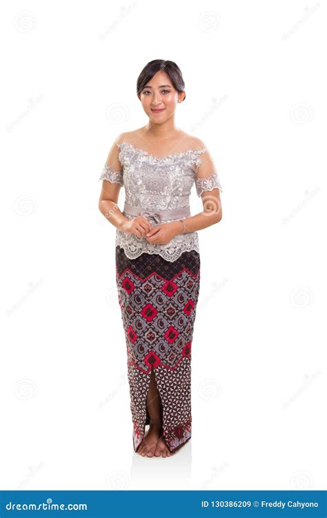 full length portrait of attractive ethnic woman wearing indonesia