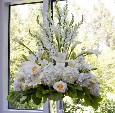 tall ceremony arrangement  white hydrangeas white  cream roses