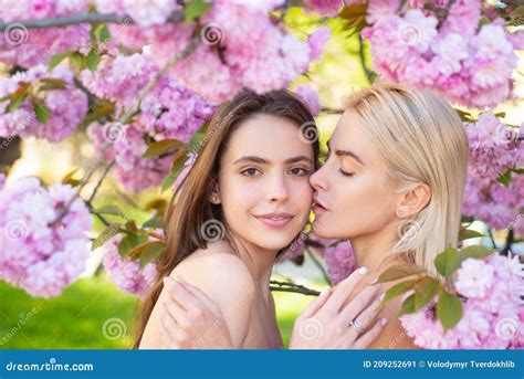 Portrait Of A Two Beautiful Spring Girls Two Young Women Relaxing In