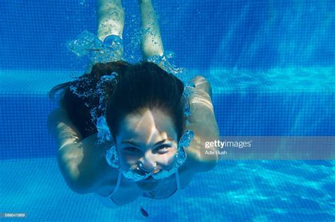 Underwater Portrait Of Girl Underwater Swimming In Swimming Pool Photo