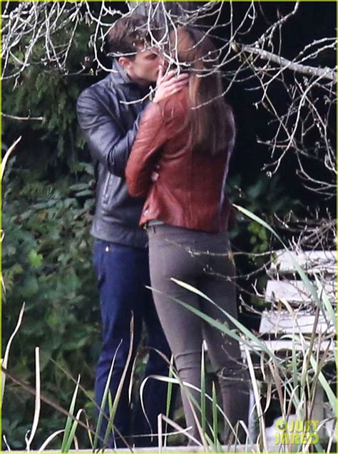 jamie dornan and dakota johnson kiss in the woods for fifty shades of grey reshoots photo
