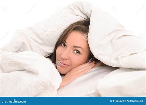 young attractive woman covered  blanket stock photo image
