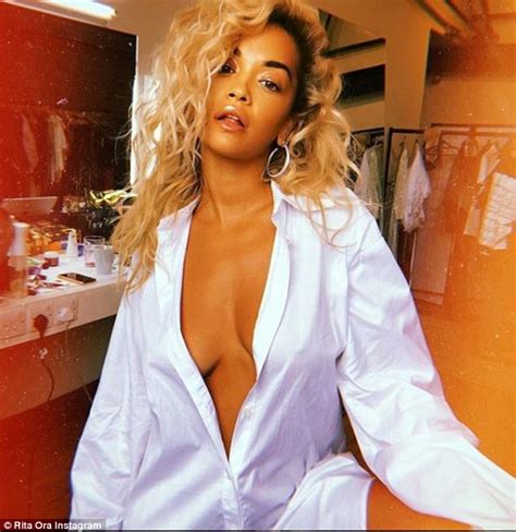 rita ora goes braless as she poses in an open shirt in instagram post daily mail online