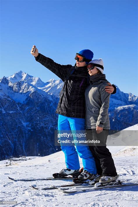 Photographing Snow Skier Teenage Couple Taking Selfie Photo Alps