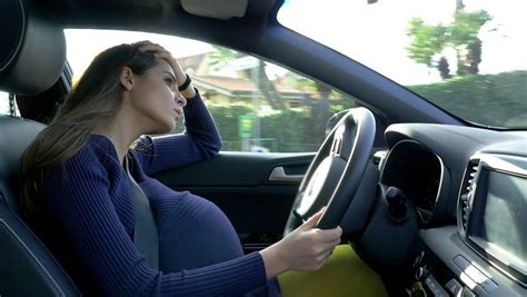 happy pregnant mother dancing like crazy full of joy driving car stock footage video 25285871