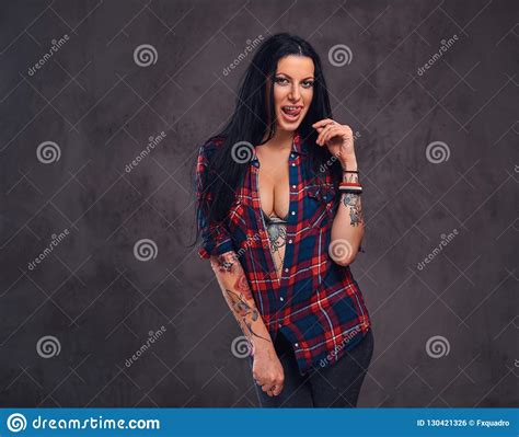 Seductive Tattooed Girl Wearing A Red Unbuttoned Checked Shirt Stock