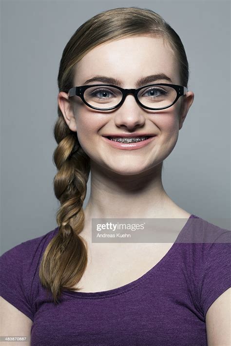 teenage girl with braces and glasses smiling high res