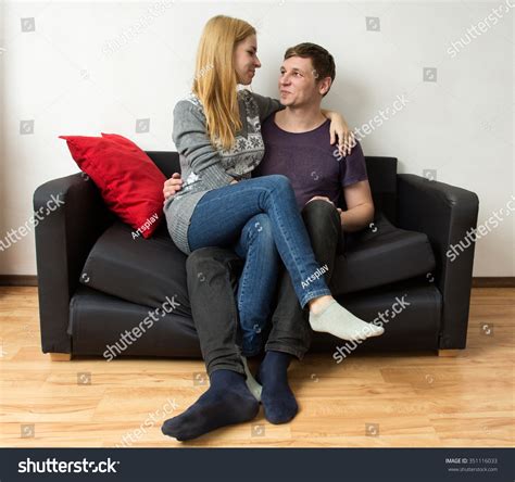 Couple Is Sitting On The Sofa Woman Is Sitting On Man S