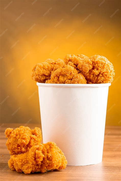 premium photo crispy fried chicken   bucket chicken bucket