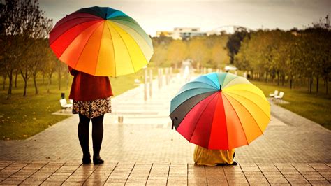 Two Women With Colorful Umbrellas In The Rain Wallpaper Download 3840x2160