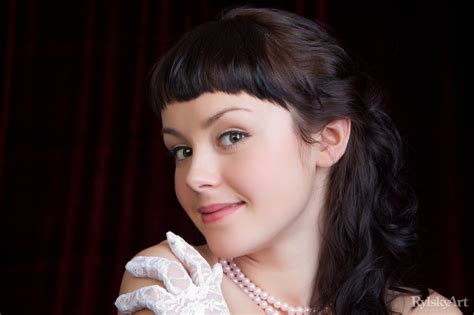 elegant brunette mireille wears white gloves and pearls while masturbating