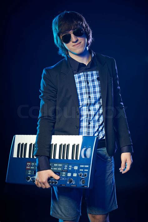 musician holding  keyboard stock image colourbox