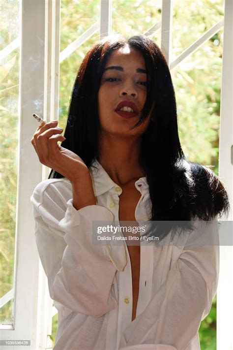 Portrait Of Beautiful Woman Smoking Cigarette Photo Getty Images