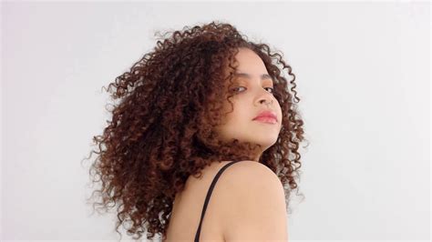 mixed race black woman with freckles and curly hair