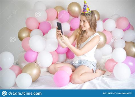 Photo Of Joyful Woman Smiling And Taking Selfie Photo On Cellphone With