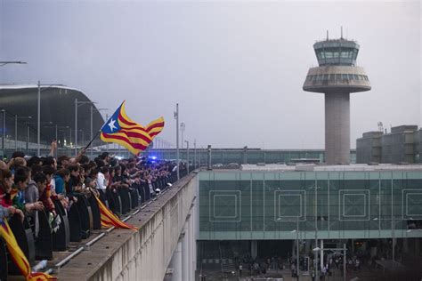 tourist dies  catalan airport chaos  riots paralyse barcelona  spain jails independence